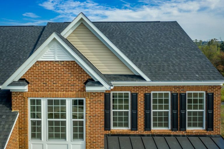 Beautiful luxury American colonial traditional estate model home on a new development with two car garage, brick siding, fiber cement shingle gable roof, North Oaks MN