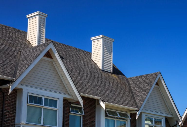 Large house with a new shingle roof in North Oaks