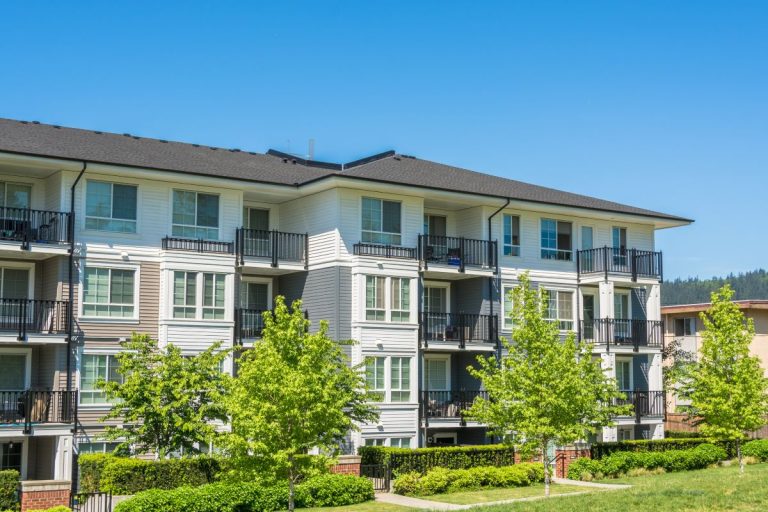 apartment complex with dark asphalt shingle roof in North Oaks